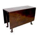 A mahogany drop leaf table, with gate leg action, raised on straight legs, 114 by 47 (157 extended) ... 