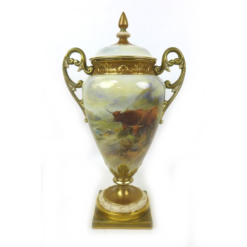 A large Royal Worcester vase and cover by John Stinton, circa 1910, the trophy shaped, twin handled vase painted with two highland cattle in a landscape scene, signed by John Stinton and marked to the base, 36cm high.