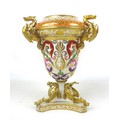 A large early 19th century Derby Campana urn, applied with gilded mythical dragons to the rim and ba... 
