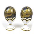 Two Royal Crown Derby Faberge eggs, in 'Black Aves', both in original boxes and egg cups, with gold ... 