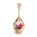 A Royal Worcester bottle vase, painted all round with pink and red roses in full bloom, dated 1911, ... 