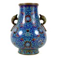 A Chinese cloisonné enamel twin handled vase, Qing Dynasty, mid to late 19th century, of Hu form, de... 