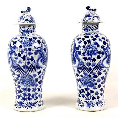 11 - A pair of Chinese porcelain vases, Qing Dynasty, 19th century, each of baluster form, the associated... 