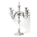 A 20th century Rococo style silver plated four branch candelabra, with scroll decoration, mounted wi... 