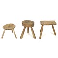 A group of three milking stools, two circular and one rectangular, all with splayed legs, tallest 37... 
