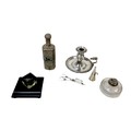 A collection of four silver plate items, comprising a chamber stick with snuffer and wick cutter wit... 