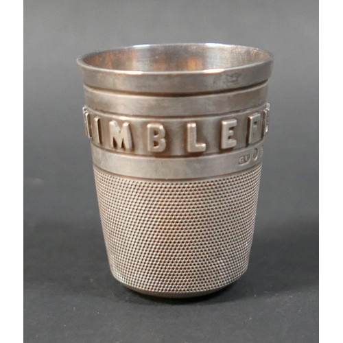 25 - A small collection of silver, including a Victorian silver stirrup cup, in the form of an oversized ... 