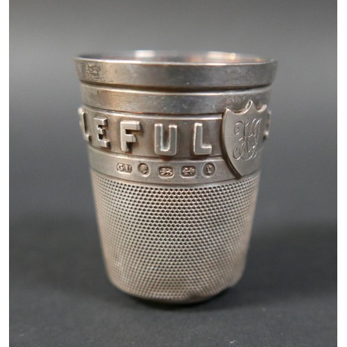 25 - A small collection of silver, including a Victorian silver stirrup cup, in the form of an oversized ... 