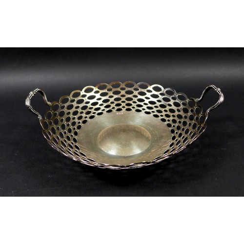 83 - A George V twin handled silver fruit bowl, of circular form with pierced looped decoration, with rub... 