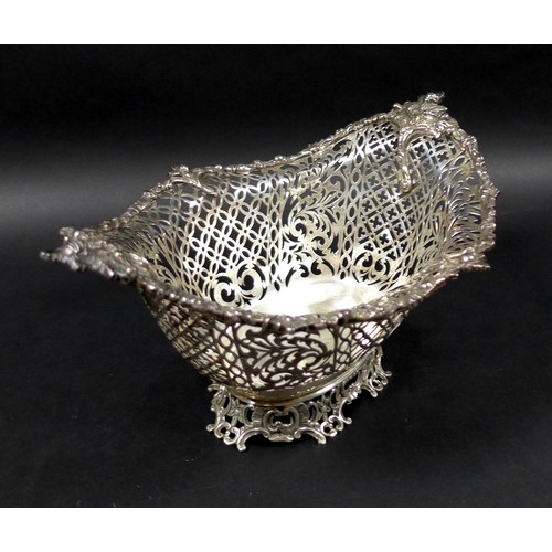 113 - A Edwardian silver centrepiece, with scroll and foliate decorative rims and pierced decoration to it... 