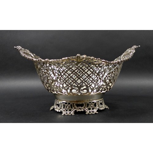 113 - A Edwardian silver centrepiece, with scroll and foliate decorative rims and pierced decoration to it... 