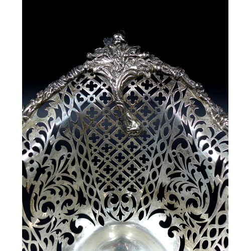 113 - A Edwardian silver centrepiece, with scroll and foliate decorative rims and pierced decoration to it... 