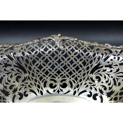 113 - A Edwardian silver centrepiece, with scroll and foliate decorative rims and pierced decoration to it... 