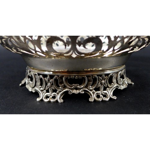 113 - A Edwardian silver centrepiece, with scroll and foliate decorative rims and pierced decoration to it... 