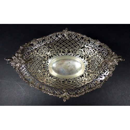 113 - A Edwardian silver centrepiece, with scroll and foliate decorative rims and pierced decoration to it... 