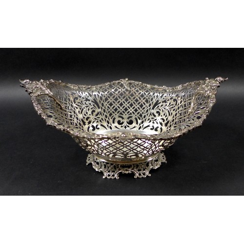 113 - A Edwardian silver centrepiece, with scroll and foliate decorative rims and pierced decoration to it... 