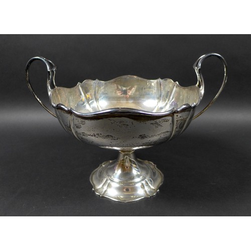 114 - A George V silver twin handled fruit bowl, raised upon base, Manoah Rhodes & Sons Ltd. Sheffield 192... 