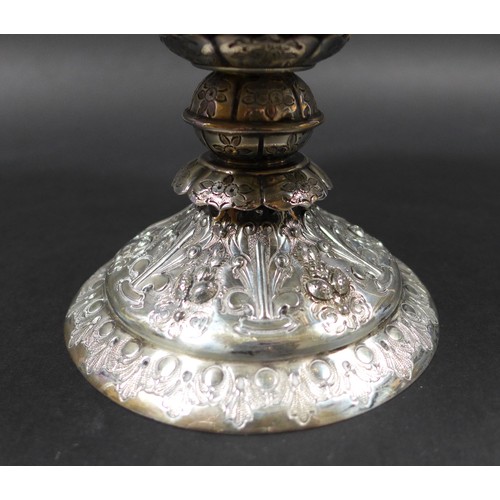 82 - A Victorian silver tazza, of circular form with profuse raised foliate decoration raised upon a step... 