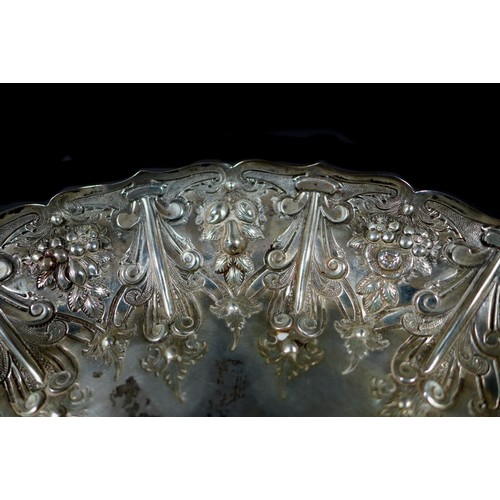 82 - A Victorian silver tazza, of circular form with profuse raised foliate decoration raised upon a step... 