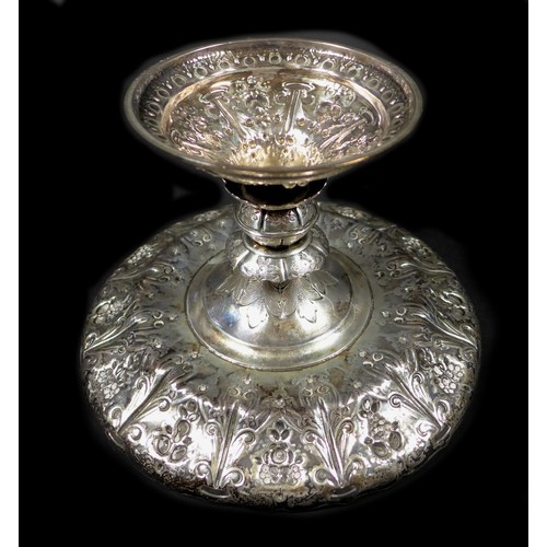 82 - A Victorian silver tazza, of circular form with profuse raised foliate decoration raised upon a step... 