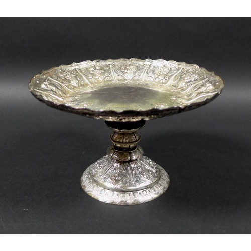 82 - A Victorian silver tazza, of circular form with profuse raised foliate decoration raised upon a step... 