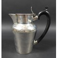 An Edwardian silver hot water jug, with ebonised handle, hinged lid, Charles Boyton (III), London 19... 