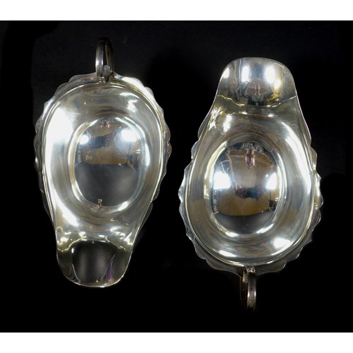39 - Four pieces of George V and later silver, comprising two George V sauce boats, Mappin & Webb, Birmin... 