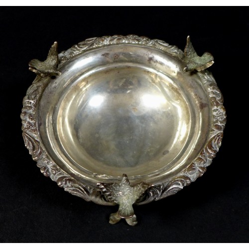 65 - Three pieces of 19th century white metal, comprising a 1950s white metal twin handled serving dish, ... 