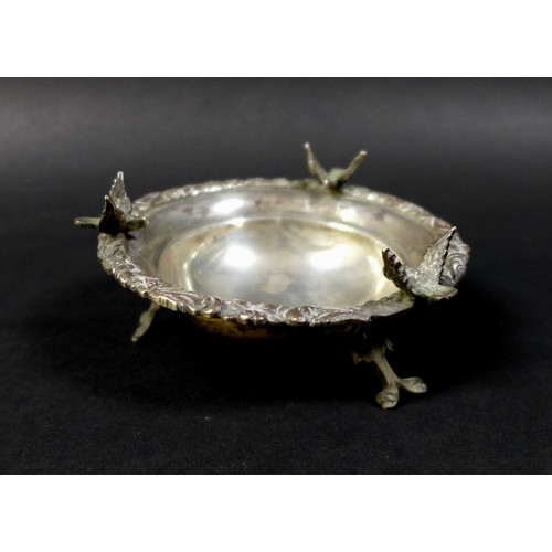 65 - Three pieces of 19th century white metal, comprising a 1950s white metal twin handled serving dish, ... 