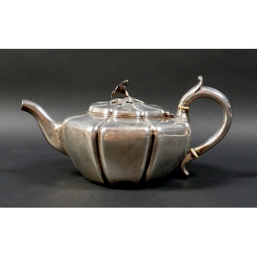 112 - A Regency silver teapot, of lobed form with flower head finial, ivory insulators, 12cm high, 17.7toz... 