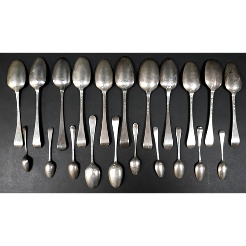 103 - A collection of Georgian silver table and tea spoons, some with shell, flame, and rat tail bowls, va... 