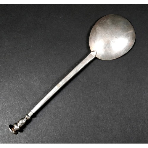 105 - A 17th century silver seal top spoon, prick engraved finial, with circular bowl, 39.2g, 16.3cm long.