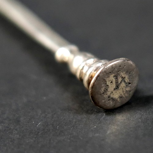 105 - A 17th century silver seal top spoon, prick engraved finial, with circular bowl, 39.2g, 16.3cm long.