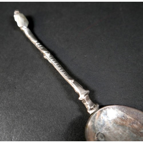 106 - A 17th century silver shield finial and scroll stemmed spoon, possibly Dutch, with oval bowl engrave... 