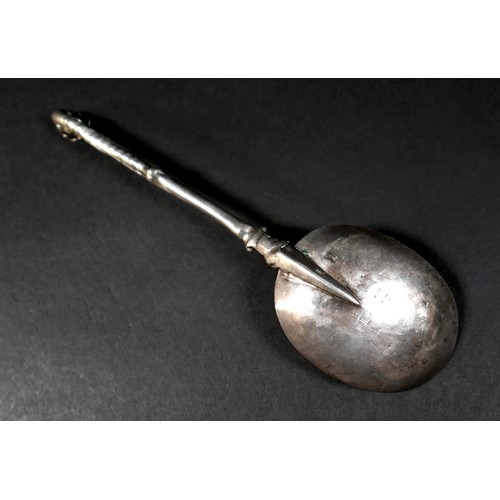 106 - A 17th century silver shield finial and scroll stemmed spoon, possibly Dutch, with oval bowl engrave... 