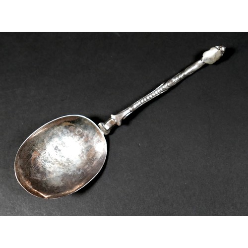 106 - A 17th century silver shield finial and scroll stemmed spoon, possibly Dutch, with oval bowl engrave... 