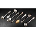 A group of four 18th and 19th century silver salt and mustard spoons, together with two teaspoons, a... 