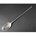 An 18th century silver mote spoon, the oval bowl with scroll piercings, shell clasped, and engraved ... 