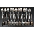A collection of Georgian and later silver table spoons, mostly Hanoverian pattern, some terminal eng... 