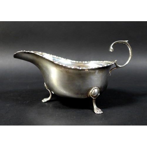 41 - Three pieces of George V and later silver, comprising a George V silver sauce boat, Robert Pringle &... 