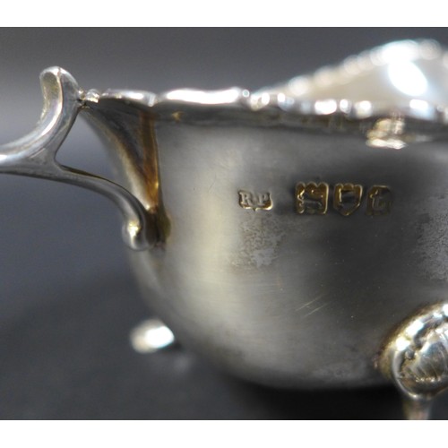 41 - Three pieces of George V and later silver, comprising a George V silver sauce boat, Robert Pringle &... 