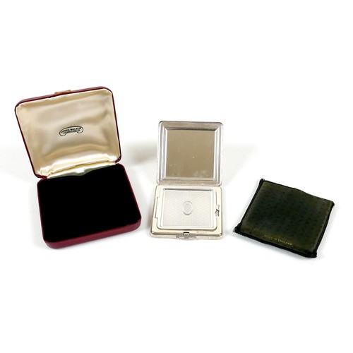 3 - An Elizabeth II silver compact mirror, by Kigu of London, of square form with engraved decoration, t... 
