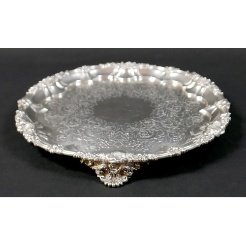 97 - A Georgian silver waiter tray, of circular form with Chippendale pie crust edge, likely later chased... 