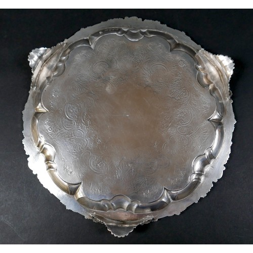 97 - A Georgian silver waiter tray, of circular form with Chippendale pie crust edge, likely later chased... 