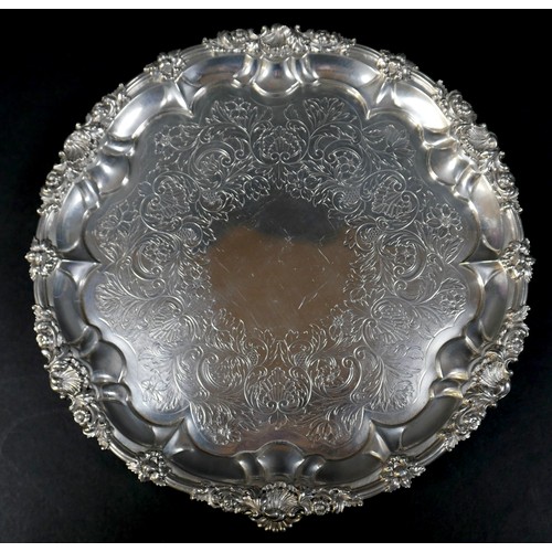 97 - A Georgian silver waiter tray, of circular form with Chippendale pie crust edge, likely later chased... 