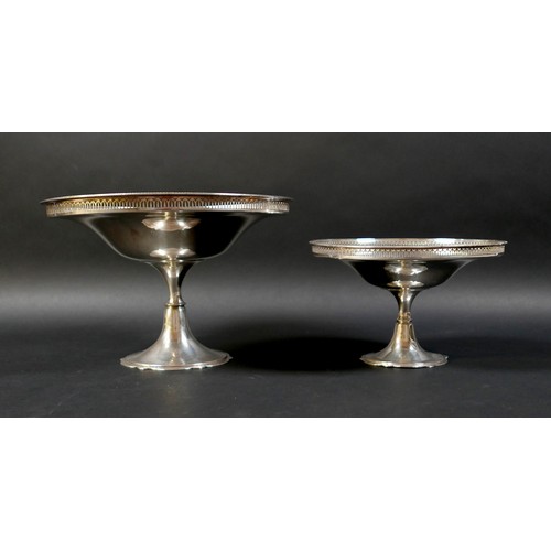 99 - A set of two silver pedestal dishes, each of circular form with pierced gallery, raised on tapering ... 