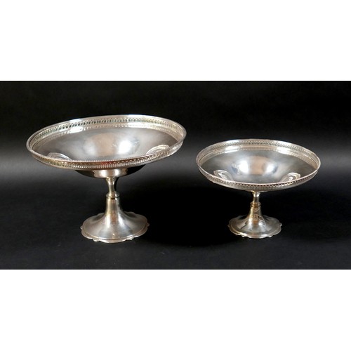 99 - A set of two silver pedestal dishes, each of circular form with pierced gallery, raised on tapering ... 