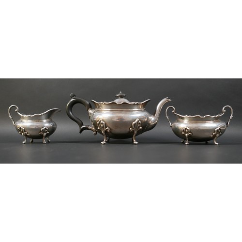 127 - A Scottish silver three piece tea service, comprising teapot, 28.5 by 13 by 13cm high, 25.7toz, twin... 