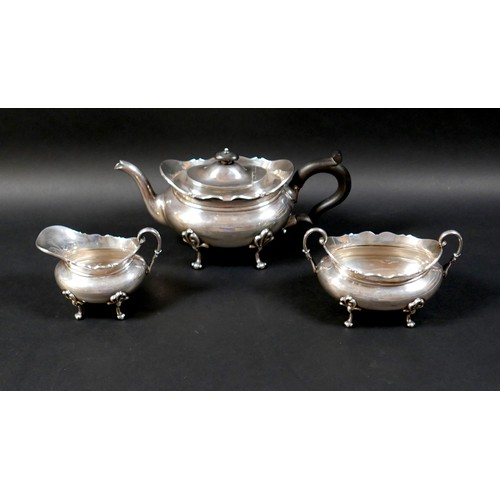 127 - A Scottish silver three piece tea service, comprising teapot, 28.5 by 13 by 13cm high, 25.7toz, twin... 