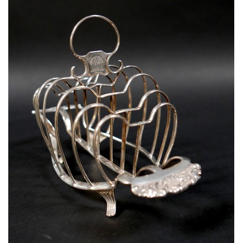 36 - A George III silver six division toast rack, with heart shaped dividers and shell handles, raised on... 